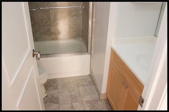 full bath with marble finish floors, vanity, toilet, and shower / bath combination with glass door