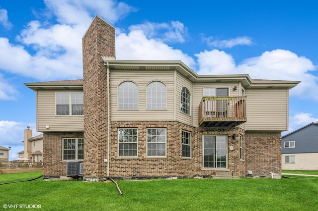 3140 Juniper Ct, Lynwood, IL 60411 - back of property with a balcony, a chimney, a lawn, and brick siding