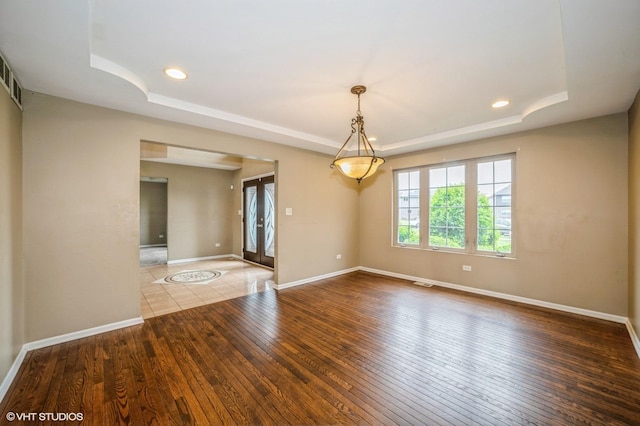3140 Juniper Ct, Lynwood, IL 60411 - unfurnished room with a raised ceiling, hardwood / wood-style flooring, baseboards, and recessed lighting