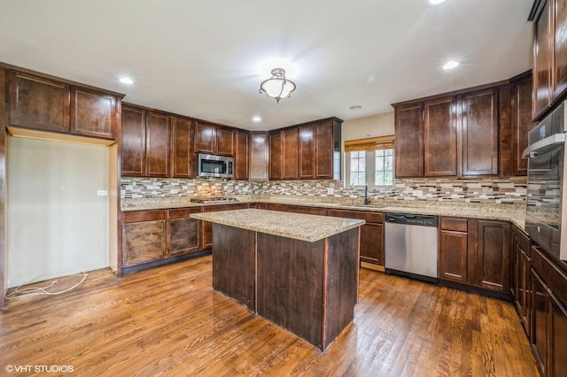 3140 Juniper Ct, Lynwood, IL 60411 - kitchen with appliances with stainless steel finishes, a sink, dark wood-style flooring, decorative backsplash, and recessed lighting