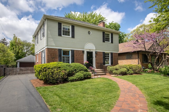 1116 S Aldine Ave, Park Ridge, IL 60068 - view of front of home featuring a chimney, brick siding, and a detached garage