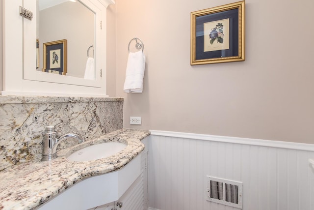 1116 S Aldine Ave, Park Ridge, IL 60068 - bathroom featuring a wainscoted wall, tasteful backsplash, and vanity