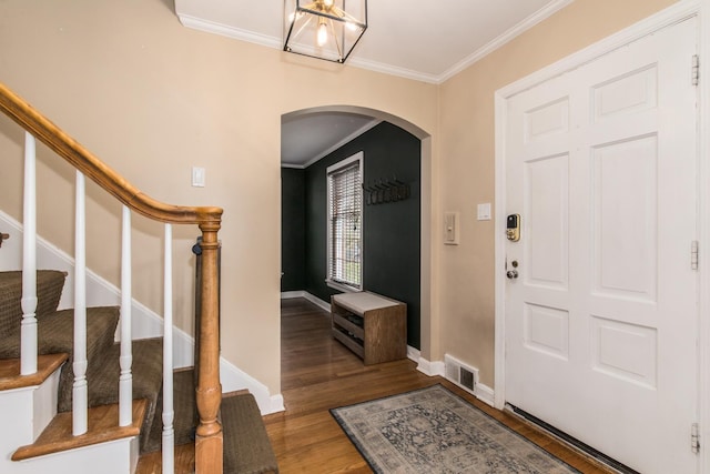 1116 S Aldine Ave, Park Ridge, IL 60068 - entryway featuring arched walkways, crown molding, wood finished floors, baseboards, and stairway