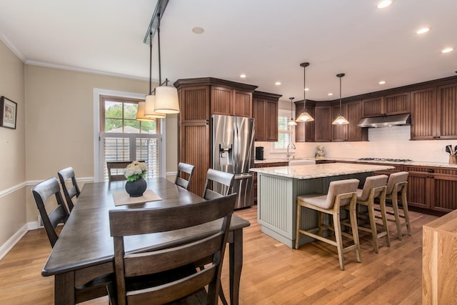 1116 S Aldine Ave, Park Ridge, IL 60068 - dining area with healthy amount of natural light, light wood-type flooring, recessed lighting, ornamental molding, and baseboards