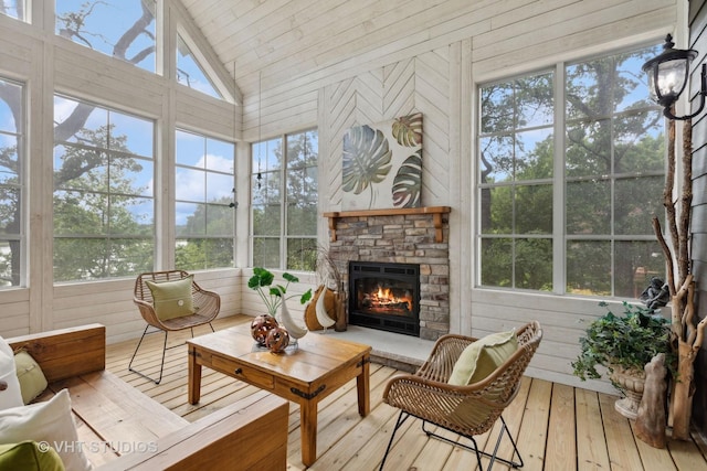 1124 Blackhawk Ave, Mchenry, IL 60051 - sunroom / solarium with a fireplace, hardwood / wood-style floors, wood walls, and lofted ceiling
