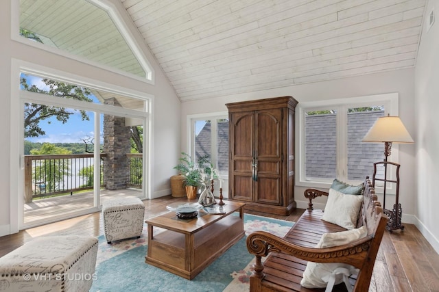1124 Blackhawk Ave, Mchenry, IL 60051 - living area featuring baseboards, wood finished floors, wooden ceiling with exposed beams, and high vaulted ceiling