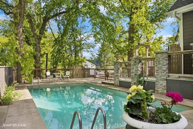1124 Blackhawk Ave, Mchenry, IL 60051 - view of pool featuring a fenced backyard and a wooden deck