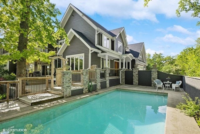 1124 Blackhawk Ave, Mchenry, IL 60051 - back of house with an outdoor pool and stone siding
