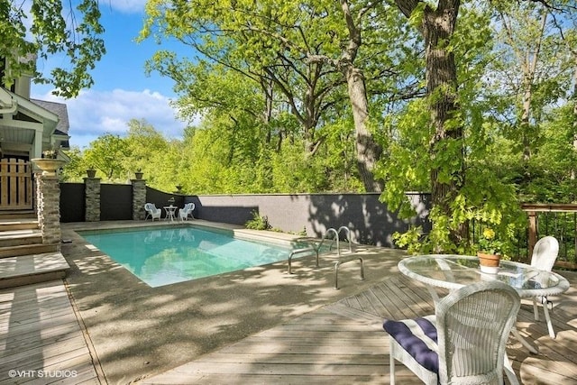 1124 Blackhawk Ave, Mchenry, IL 60051 - view of swimming pool featuring a deck and a fenced backyard