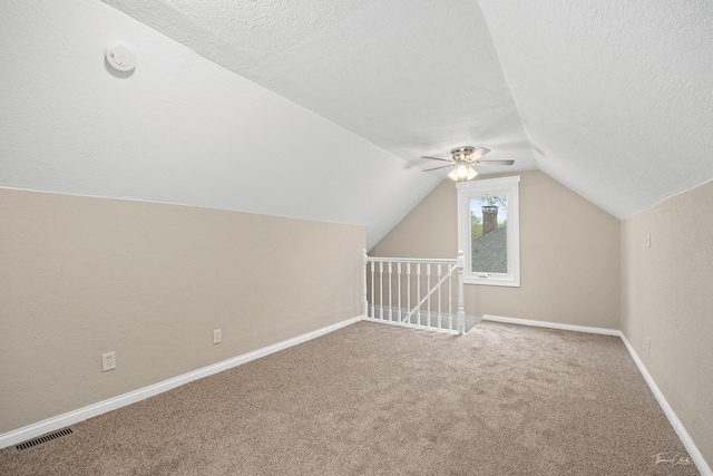 436 S Mckinley Ave, Kankakee, IL 60901 - bonus room with a textured ceiling, lofted ceiling, carpet floors, a ceiling fan, and baseboards