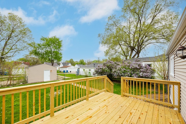436 S Mckinley Ave, Kankakee, IL 60901 - wooden terrace featuring a residential view, a shed, and an outdoor structure