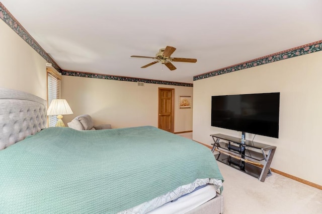 bedroom with baseboards, carpet, and ceiling fan