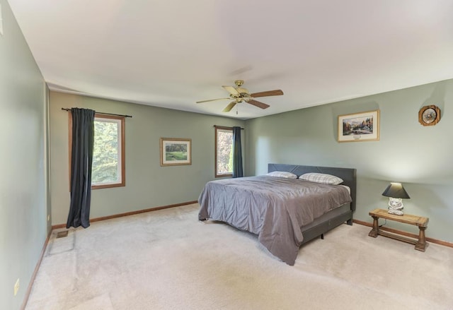 bedroom featuring carpet, baseboards, and a ceiling fan
