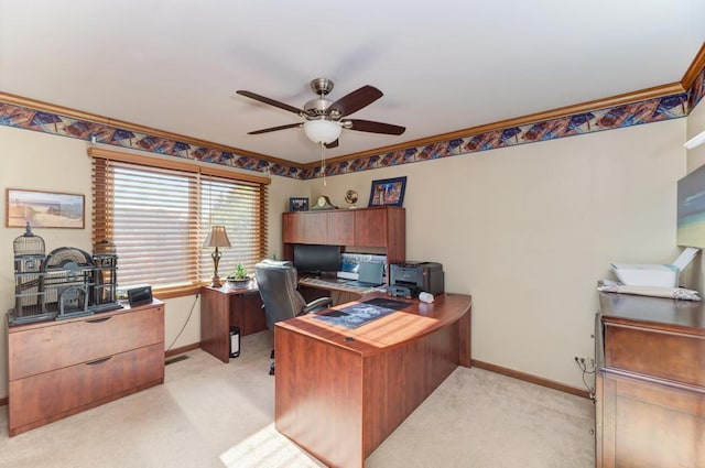 office with ceiling fan, light colored carpet, baseboards, and ornamental molding