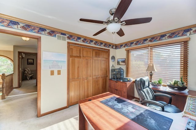 office area with ceiling fan, light colored carpet, and baseboards