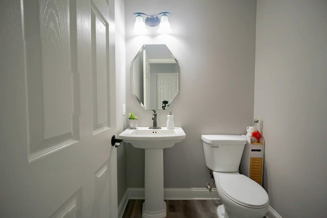 2650 Carlisle Ln, Hampshire, IL 60140 - bathroom featuring toilet, baseboards, and wood finished floors