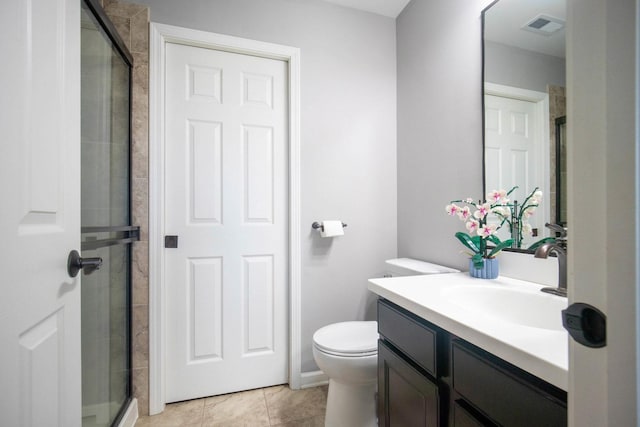 2650 Carlisle Ln, Hampshire, IL 60140 - full bathroom with a stall shower, vanity, toilet, and tile patterned floors