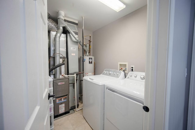2650 Carlisle Ln, Hampshire, IL 60140 - laundry room with washing machine and clothes dryer and light tile patterned flooring