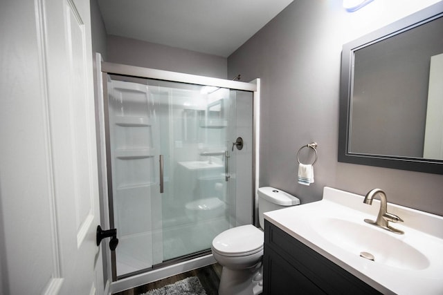 2650 Carlisle Ln, Hampshire, IL 60140 - full bath featuring toilet, a stall shower, wood finished floors, and vanity