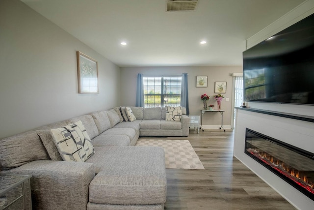 2650 Carlisle Ln, Hampshire, IL 60140 - living room with recessed lighting, wood finished floors, a glass covered fireplace, and baseboards
