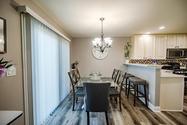 2650 Carlisle Ln, Hampshire, IL 60140 - dining space featuring light wood-type flooring, a chandelier, and recessed lighting