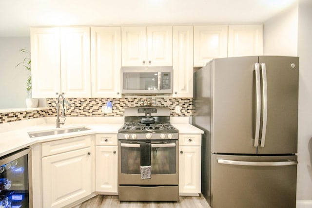 2650 Carlisle Ln, Hampshire, IL 60140 - kitchen featuring appliances with stainless steel finishes, a sink, beverage cooler, and tasteful backsplash