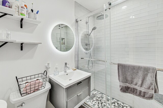 7715 W Patterson Ave, Chicago, IL 60634 - bathroom featuring toilet, a shower stall, and vanity