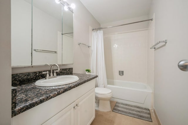 bathroom featuring toilet, vanity, shower / bath combo with shower curtain, and tile patterned floors