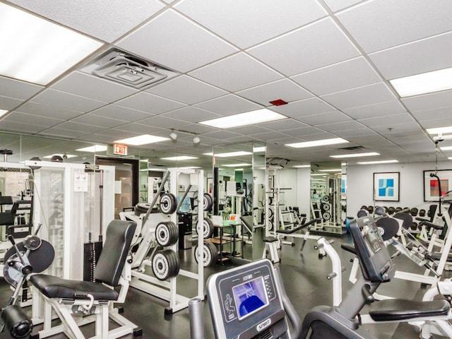 gym featuring a paneled ceiling