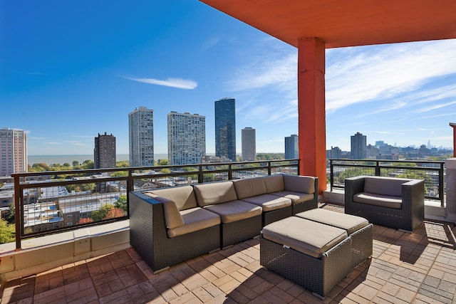 view of patio with a skyline view, outdoor lounge area, and a balcony