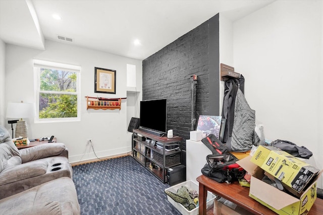 living room featuring baseboards and recessed lighting