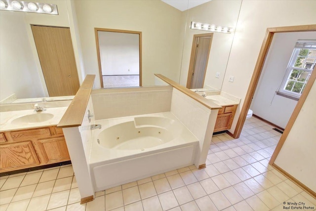 319 E Theodore Ln, Itasca, IL 60143 - full bathroom featuring a tub with jets, vanity, and tile patterned floors