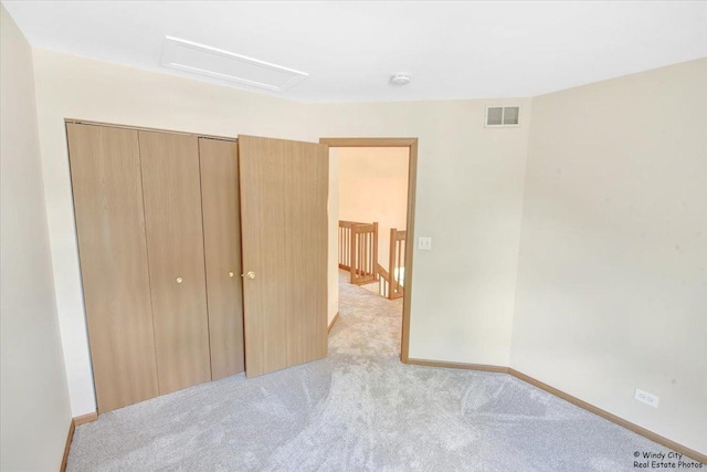 319 E Theodore Ln, Itasca, IL 60143 - unfurnished bedroom with carpet flooring, attic access, and a closet