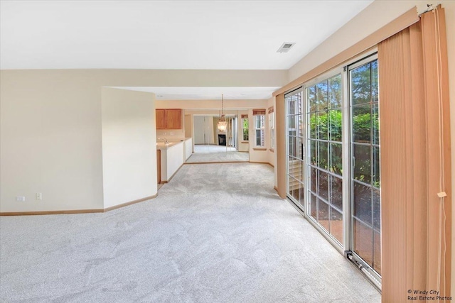 319 E Theodore Ln, Itasca, IL 60143 - unfurnished living room with light carpet