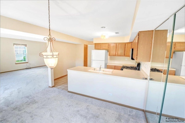 319 E Theodore Ln, Itasca, IL 60143 - kitchen with stove, freestanding refrigerator, light colored carpet, and light countertops