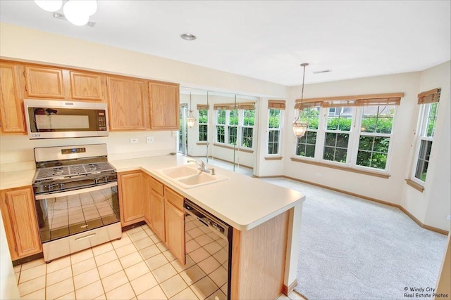 319 E Theodore Ln, Itasca, IL 60143 - kitchen featuring appliances with stainless steel finishes, light countertops, a peninsula, and light brown cabinetry