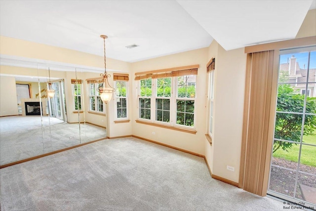 319 E Theodore Ln, Itasca, IL 60143 - unfurnished dining area featuring carpet floors and a tiled fireplace
