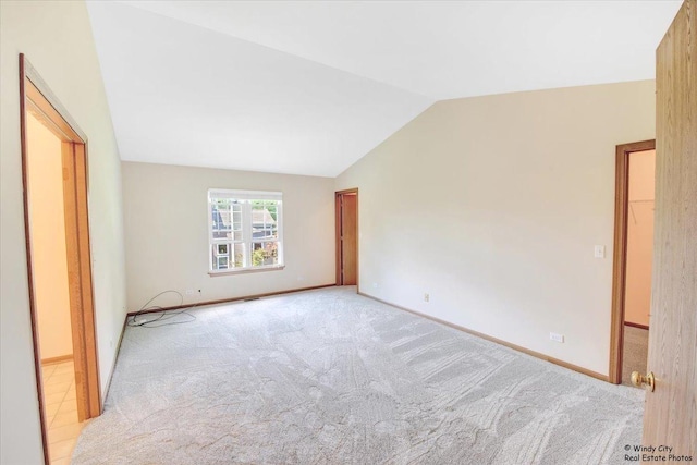 319 E Theodore Ln, Itasca, IL 60143 - unfurnished bedroom with carpet floors and vaulted ceiling