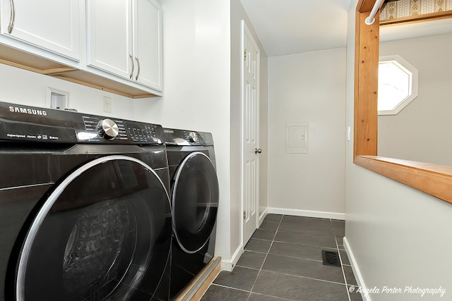 5305 N Highland Dr, Mchenry, IL 60050 - laundry area with cabinet space, separate washer and dryer, dark tile patterned flooring, and baseboards