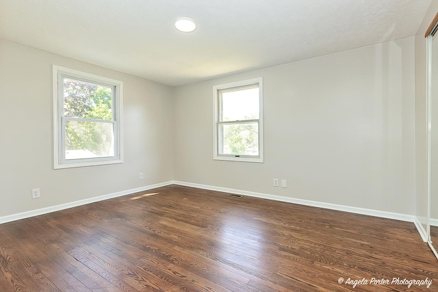 5305 N Highland Dr, Mchenry, IL 60050 - empty room with dark wood finished floors and baseboards