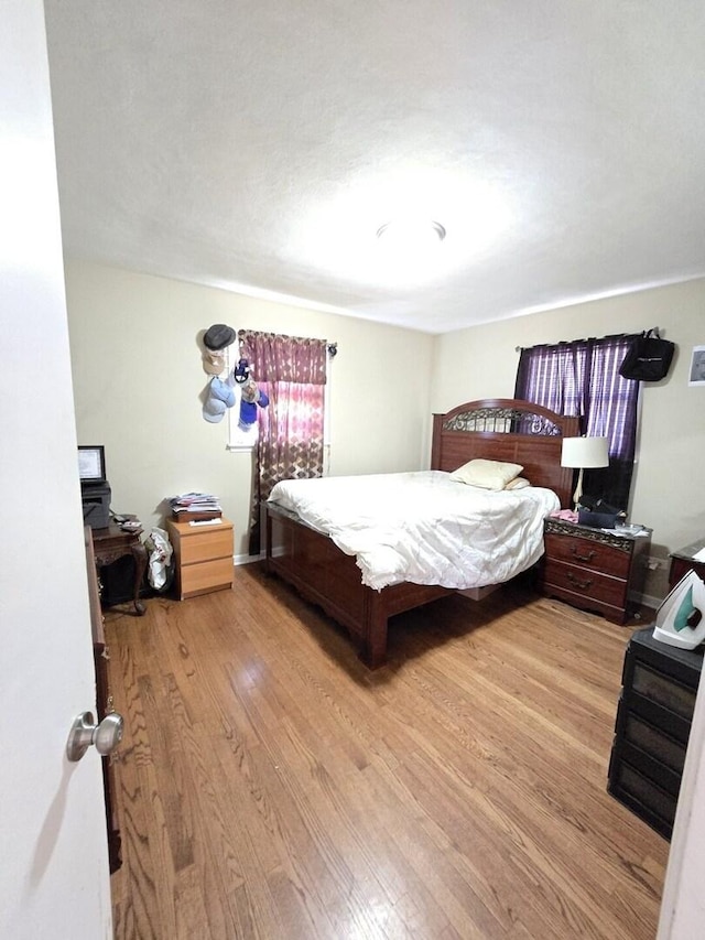 bedroom featuring light wood-style floors