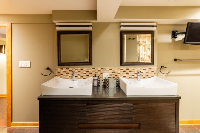 4610 Main St, Lisle, IL 60532 - bathroom with double vanity, backsplash, and baseboards