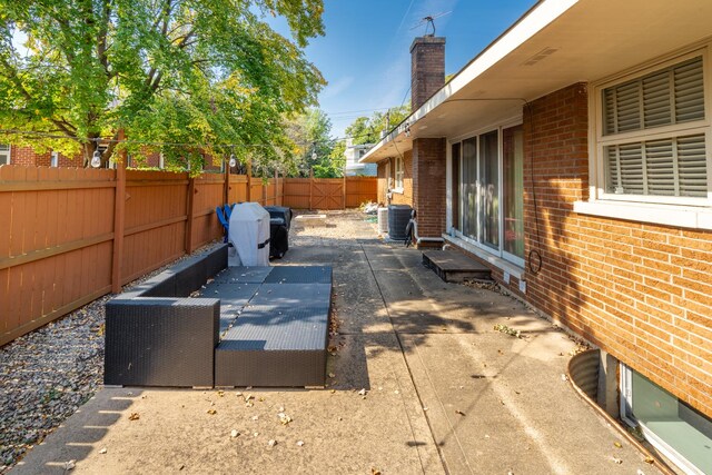 4610 Main St, Lisle, IL 60532 - view of patio with a fenced backyard and central AC unit