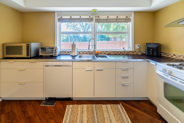 4610 Main St, Lisle, IL 60532 - kitchen featuring white appliances, a sink, white cabinetry, dark wood-style floors, and modern cabinets