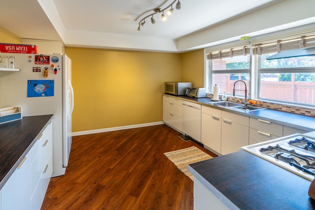 4610 Main St, Lisle, IL 60532 - kitchen with a sink, white appliances, dark wood-style flooring, white cabinets, and dark countertops