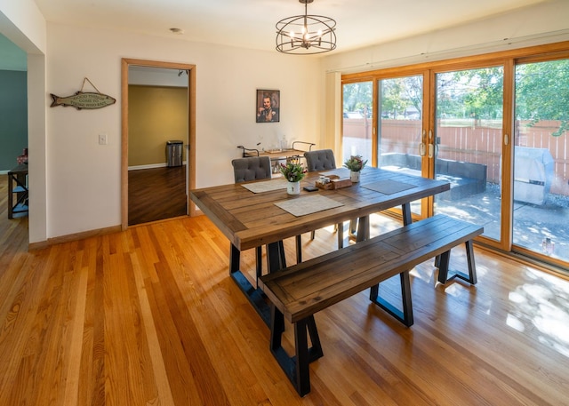4610 Main St, Lisle, IL 60532 - dining space featuring light wood-style flooring, french doors, baseboards, and a chandelier