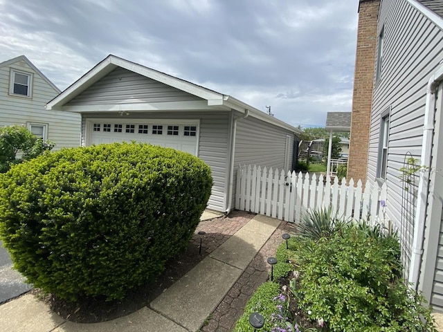 view of side of property featuring fence