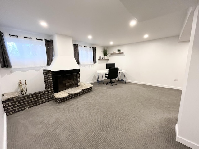 carpeted living room with recessed lighting, a fireplace, an office area, and baseboards