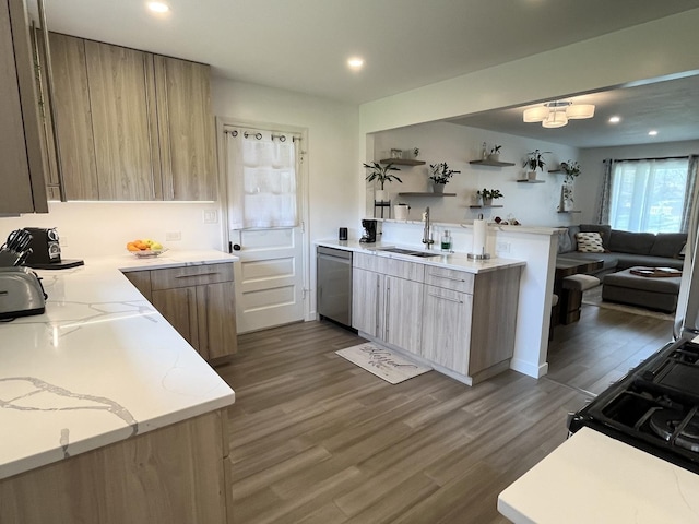 kitchen with a sink, stainless steel dishwasher, recessed lighting, dark wood finished floors, and light stone countertops