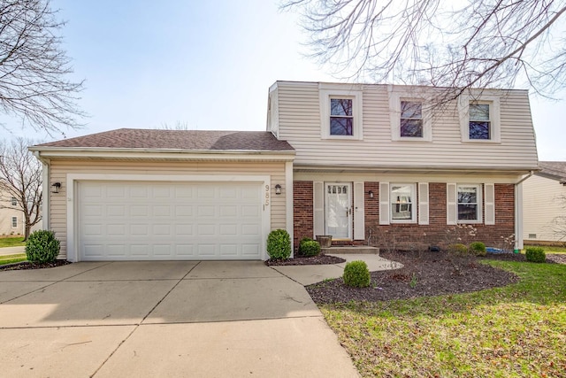 985 Knollwood Dr, Buffalo Grove, IL 60089 - view of front of home featuring driveway, an attached garage, and brick siding